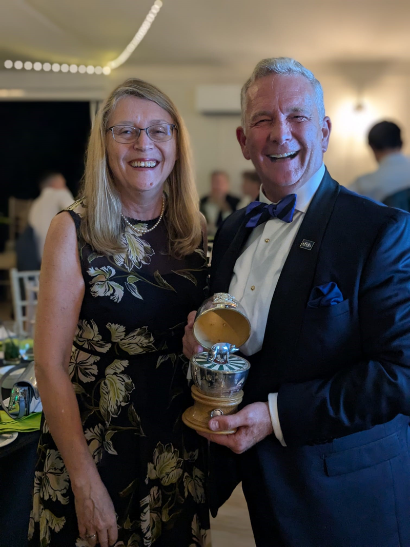 Chief Executive, Laura Taylor, stood with the winner, Iain Steele, holding the millennium egg